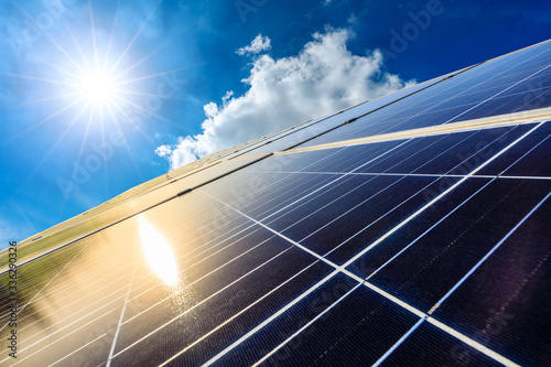 Photographie Photovoltaic solar power panel on sky background,green clean alternative energy concept