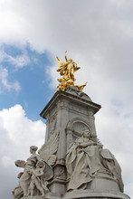 Gilded Winged Victory At The Top Of The Victoria Memorial In Front Of Buckingham Palace In A Sunny Day, London, UK