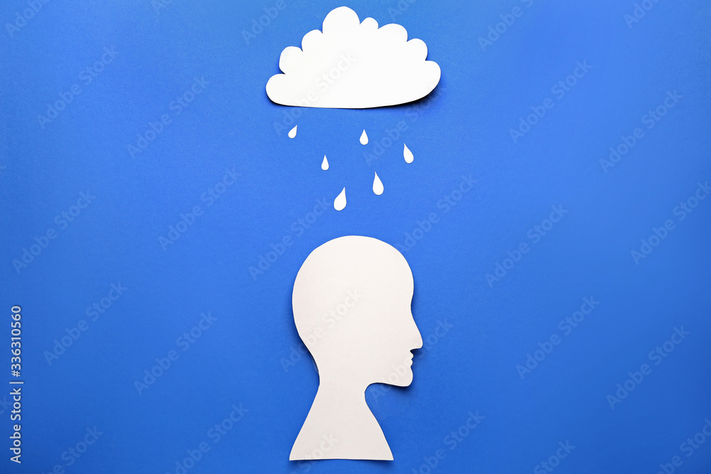Human head with cloud and rain on color background. Concept of depression