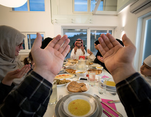 POV praying during Ramadan Iftar group meal