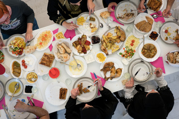 Wall Mural - Muslim family gathering for having Iftar in Ramadan together