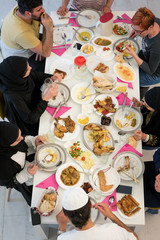 Wall Mural - Muslim family gathering for having Iftar in Ramadan together