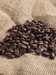 Wall Mural - Brown roasted coffee beans on sackcloth