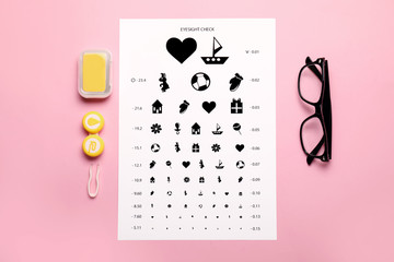 Sticker - Containers with contact lenses, eyeglasses, tweezers and eye test chart on color background