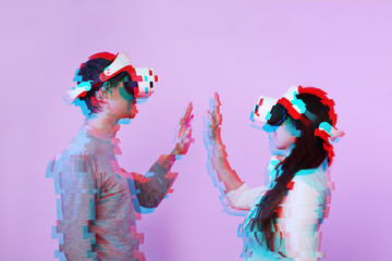 Wall Mural - couple in love communicate using a virtual reality headset. image with glitch effect.