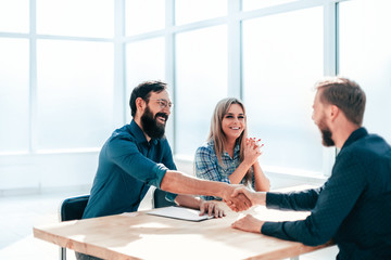 Wall Mural - business people shaking hands during the interview.