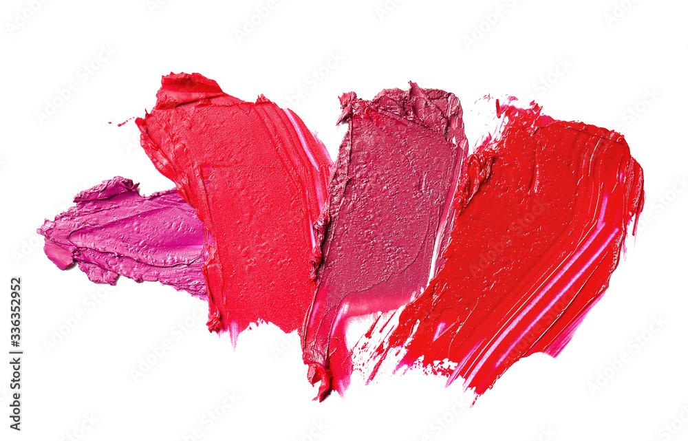 Strokes of bright lipsticks on white background