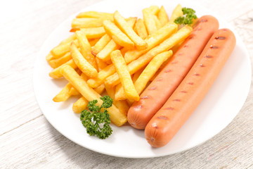 Wall Mural - french fries and sausage in plate