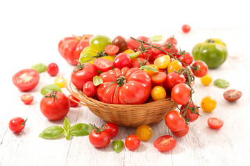 Wall Mural - wicker basket with various colorful tomato and basil