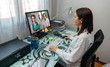 © David Pereiras - Woman talking on video call with her mother who is in hospital and female doctor giving the medical report