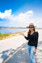 Canvas Print - Asian Woman with Mae Moh Reservoir Background