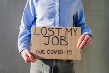 Man Office Worker In Blue Shirt With Cardboard Sign LOST JOB. Jobless, Unemployment Due Covid-19 Concept. Asking For Money