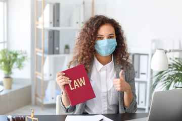 Sticker - Female lawyer in protective mask working in office