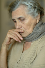 Canvas Print - Close up portrait of sad ill senior woman