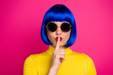 Poster - Closeup photo of attractive lady modern look hold finger on lips wear retro specs stylish yellow turtleneck blue short blue wig isolated vibrant pink color background