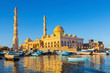 Mosque with fishing boats at sea in egypt