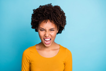 Poster - Portrait of outraged angry frustrated afro american girl have misunderstanding with her boyfriend scream loudly voice wear style stylish trendy jumper isolated over blue color background