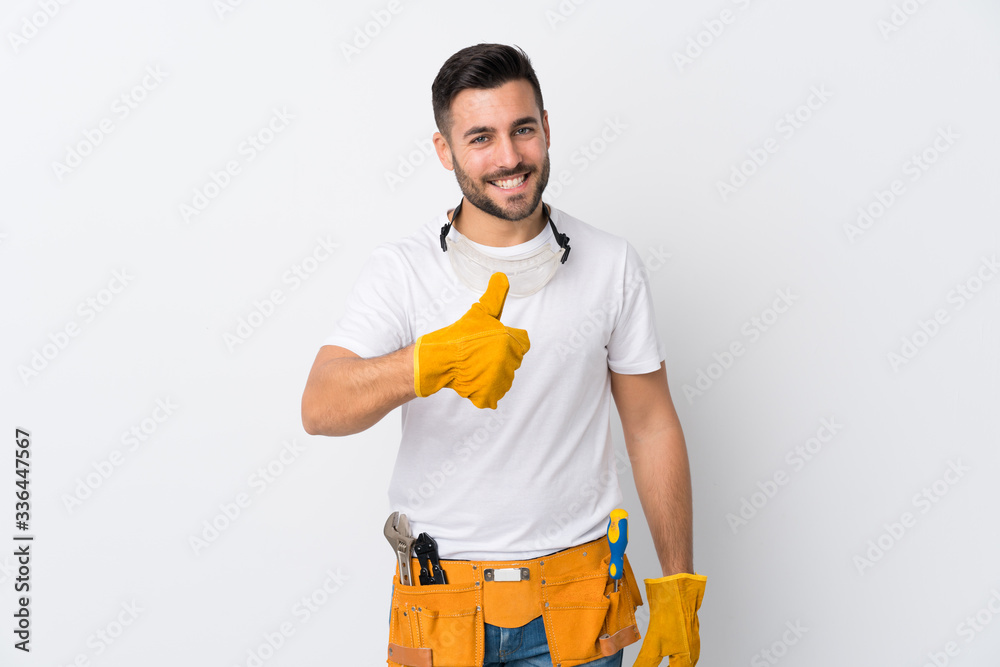 Craftsmen or electrician man over isolated white background giving a thumbs up gesture - obrazy, fototapety, plakaty 