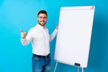 Sticker - Businessman giving a presentation on white board giving a presentation on white board