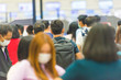 © Pavlo Vakhrushev - Crowd of people in masks waiting in airport during coronavirus quarantine