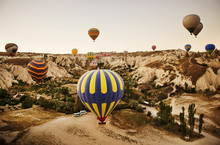 Hot Air Balloons Flying Over Landscape