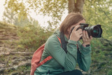 Fototapeta Na ścianę - Female hiker photographing nature landscape