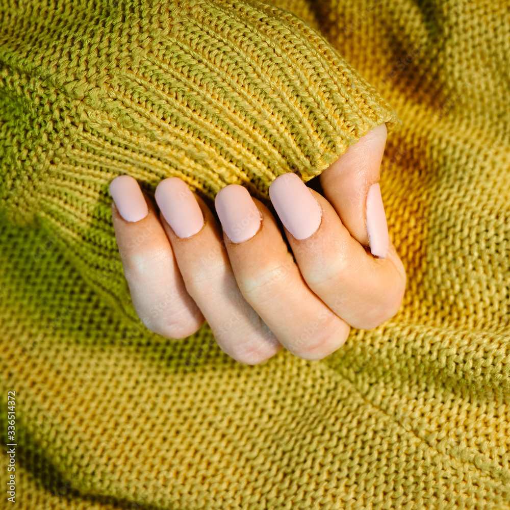 Woman's hand with pink nails - obrazy, fototapety, plakaty 