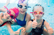 © davit85 - Underwater photo of young friends in swimming pool.