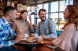 © ivanko80 - Group of friends meeting in cafe