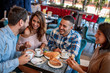 © ivanko80 - Group of friends meeting in cafe