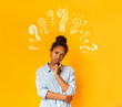 © Prostock-studio - Puzzled pensive young african american teen girl with question marks