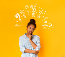 Puzzled Pensive Young African American Teen Girl With Question Marks