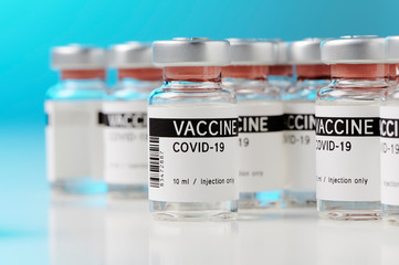 ampoules with Covid-19 vaccine on a laboratory bench. to fight the coronavirus / sars-cov-2 pandemic.