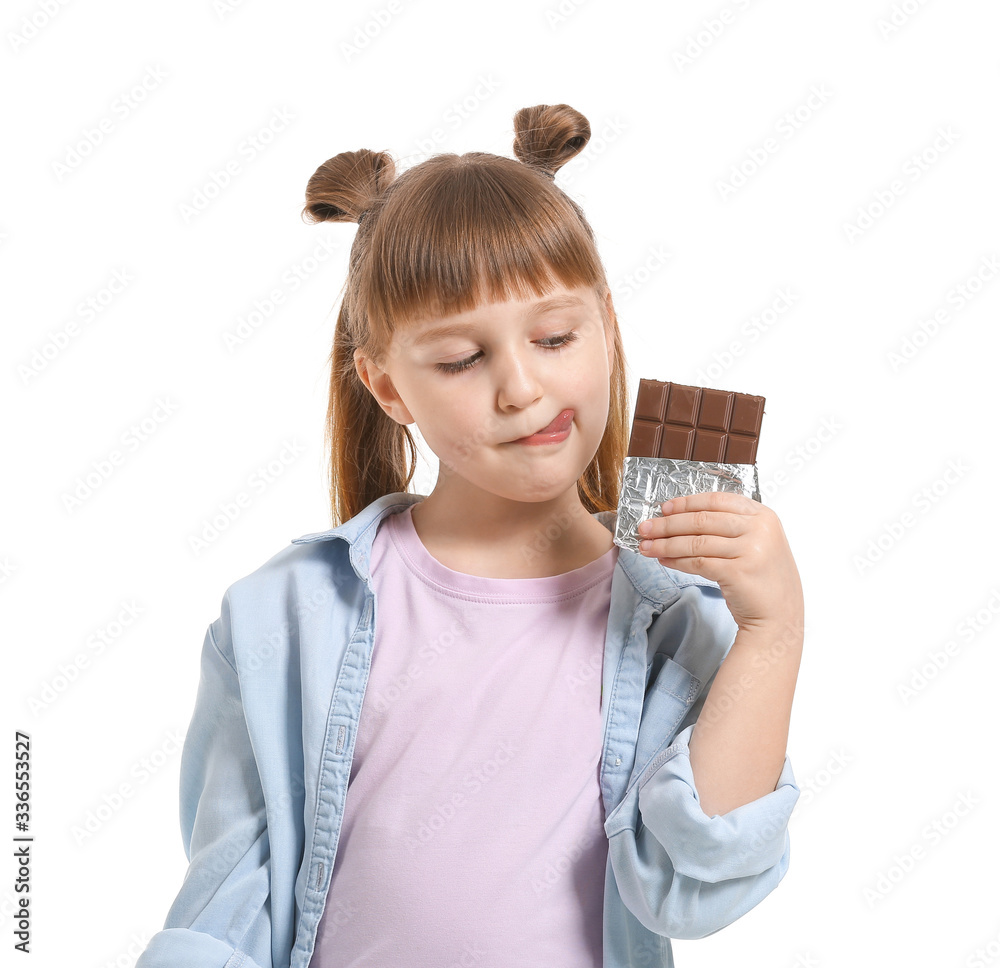 Cute little girl with chocolate on white background