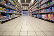 Blurred abstract background of shelf in supermarket bottom view. Department with shelves. Household chemicals in a hypermarket without people.