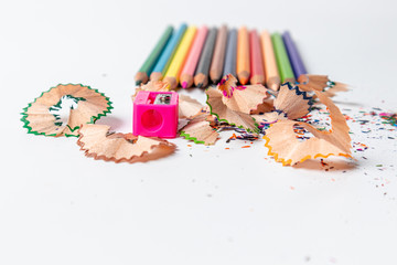 Wall Mural - Sharpener with color pencils on white background.