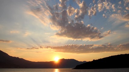 Wall Mural - Sunrise over Peljesac Peninsula and Peljeski Strait seen from Korcula, Croatia.