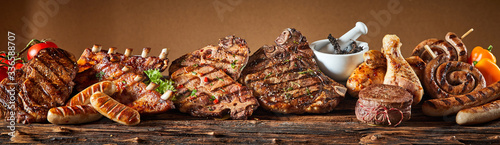 Fotografía Selection of grilled gourmet meats on timber