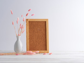 Canvas Print - Blank wooden frame with vase.