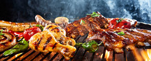 Assorted Meat Grilling Over A BBQ Outdoors