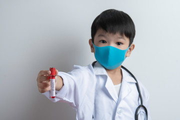 Corona Virus Concept. Boy demonstrating Test-Tube, holds tube containing a patient’s blood sample at laboratory. COVID-19. Conduct laboratory testing - Positive result. 2019-nCoV virus.