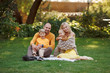 © Olga Gordeeva - family in nature, summer or autumn, green grass trees in green leaves, a pond in nature, mom blonde in a yellow dress, dad, husband, older son and youngest son, two children, a large and happy family