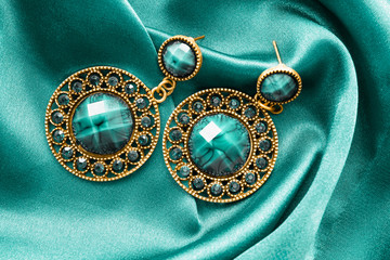 Poster - Earrings on blue satin