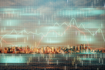 Forex chart on cityscape with skyscrapers wallpaper double exposure. Financial research concept.