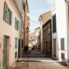 Travel summer concept. Old city view of Europe, Croatia, Istria region, Rovinj. Empty street with old buildings with shutters.