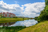 Fototapeta Na drzwi - Reflection in a pond on the outskirts of the city