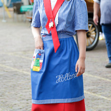 Woman Wearing A Traditional Costume During The Weekly Cheese Festival, Edam, The Netherlands.