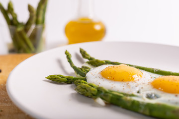 Wall Mural - Stir-fried eggs with green asparagus. Fast lunch ideas, healthy breakfast, summer food.