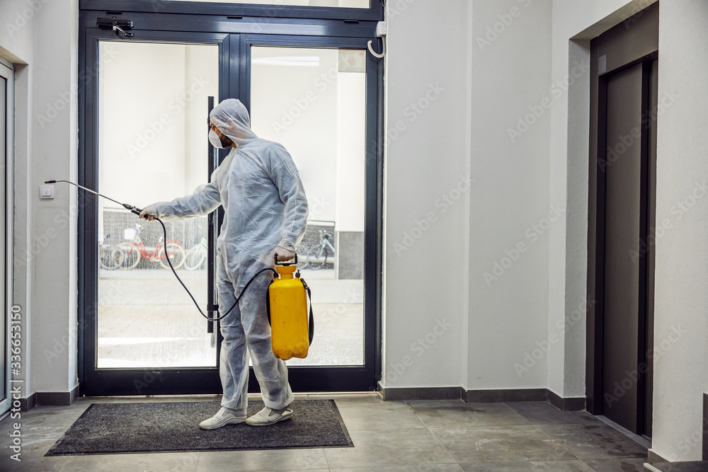 Sanitizing interior surfaces. Cleaning and Disinfection inside buildings, the coronavirus epidemic. Professional teams for disinfection efforts. Infection prevention and control of epidemic.  - obrazy, fototapety, plakaty 