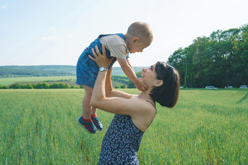 Poster - mother holding son touching her face